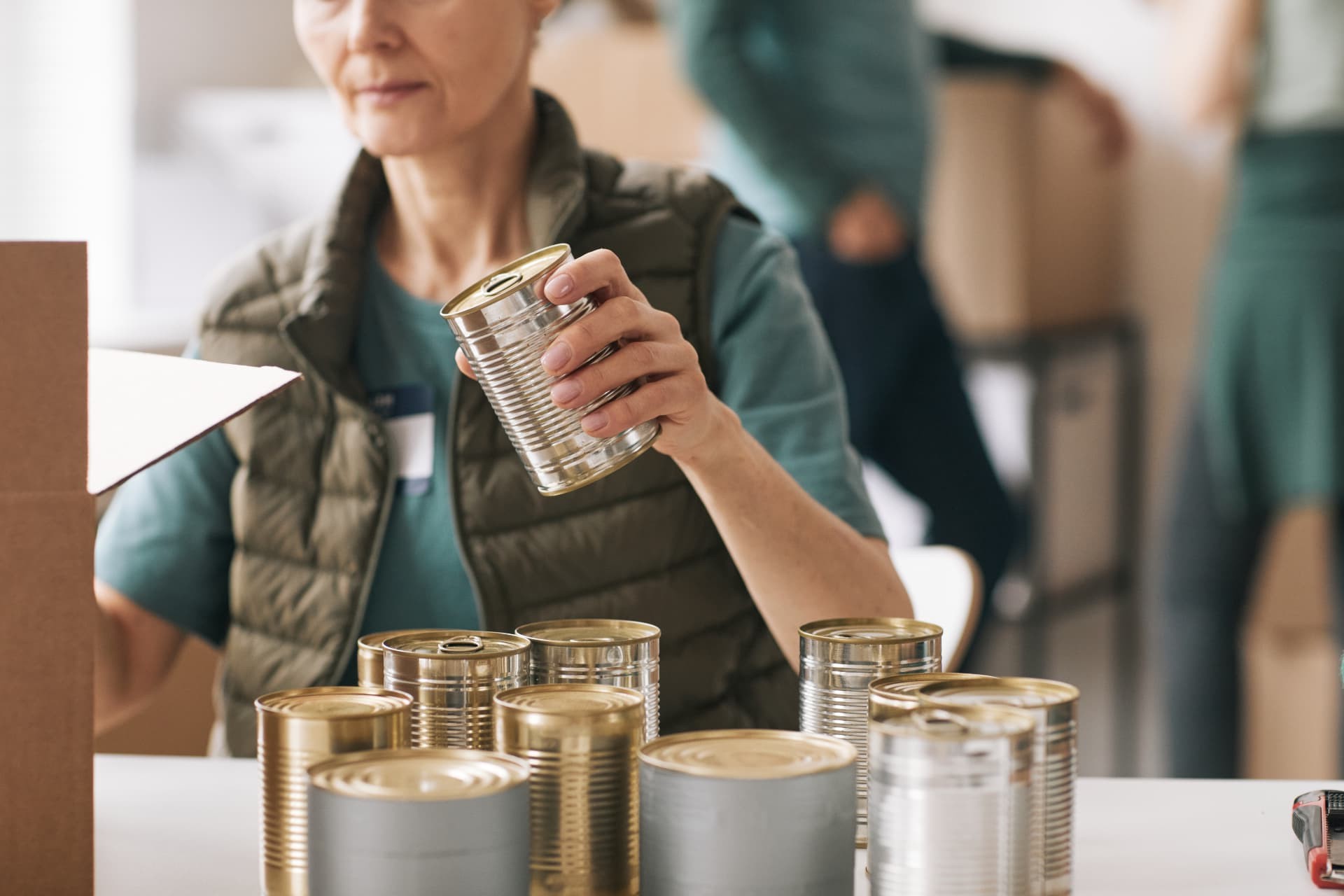 Volunteers sorting canned food for donation